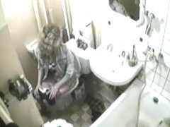 Blonde was caught in the intimate moment of peeing on toilet