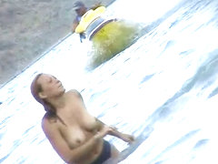 Curvy  babes filmed on a nude beach