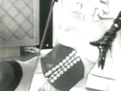 Lesbians wear hot stockings in this vintage porn clip
