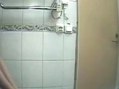 Girl in black clothes pees in toilet