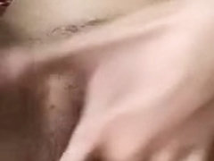 Slut with hairy muff is seen masturbating in the clip