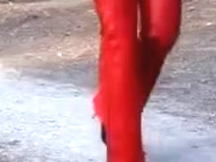 Anja in red leather catsuit & high heels