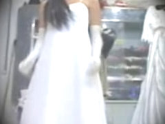 Asian bride spied in lingerie trying on the luxurious dressed