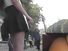 Smoking brunette chick caught on the upskirt camera