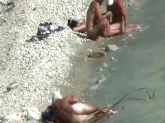Two nudist couples spied at rocky beach
