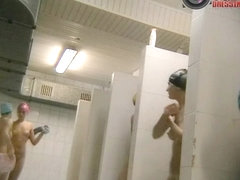 Skinny brunette and friends naked on a voyeur bathroom cam