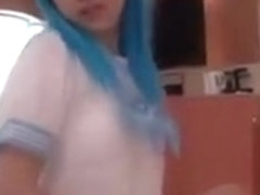Japanese cosplay girl with light blue hair