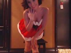 Bea in her christmas outfit fingering her pussy