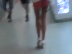 Chick in shiny hose walking down the street