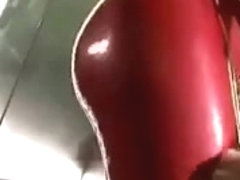 Golden-Haired wearing red latex catsuit