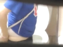 Brunette woman spied in public toilet pissing