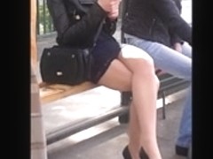 Girl with sexy legs in mini skirt and high heels