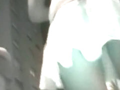 Slutty looking girl in short skirt on the upskirt night footage