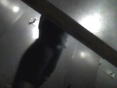 Half naked amateur girl in the dark dressing room on spy cam