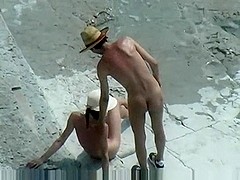 Bare beachgoers caught fucking on cam