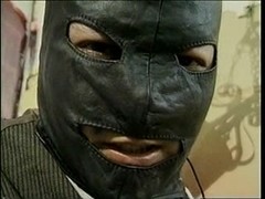 Bondage act with a tranny and chap in mask