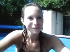 Cute brunette girl shows off her small tits the swimming pool
