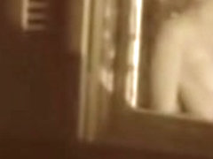 Man kissing the naked lover on window voyeur movie