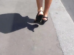 beautifull legs walking in the street in mini shorts