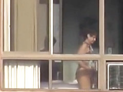 Naked mature spied through her apartment window