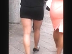 Woman in pantyhose, mini skirt and high heels