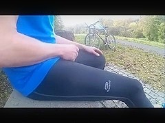 Young pissing and wanking in black lycra in public park