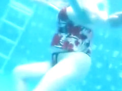 Busty mature woman filmed under water